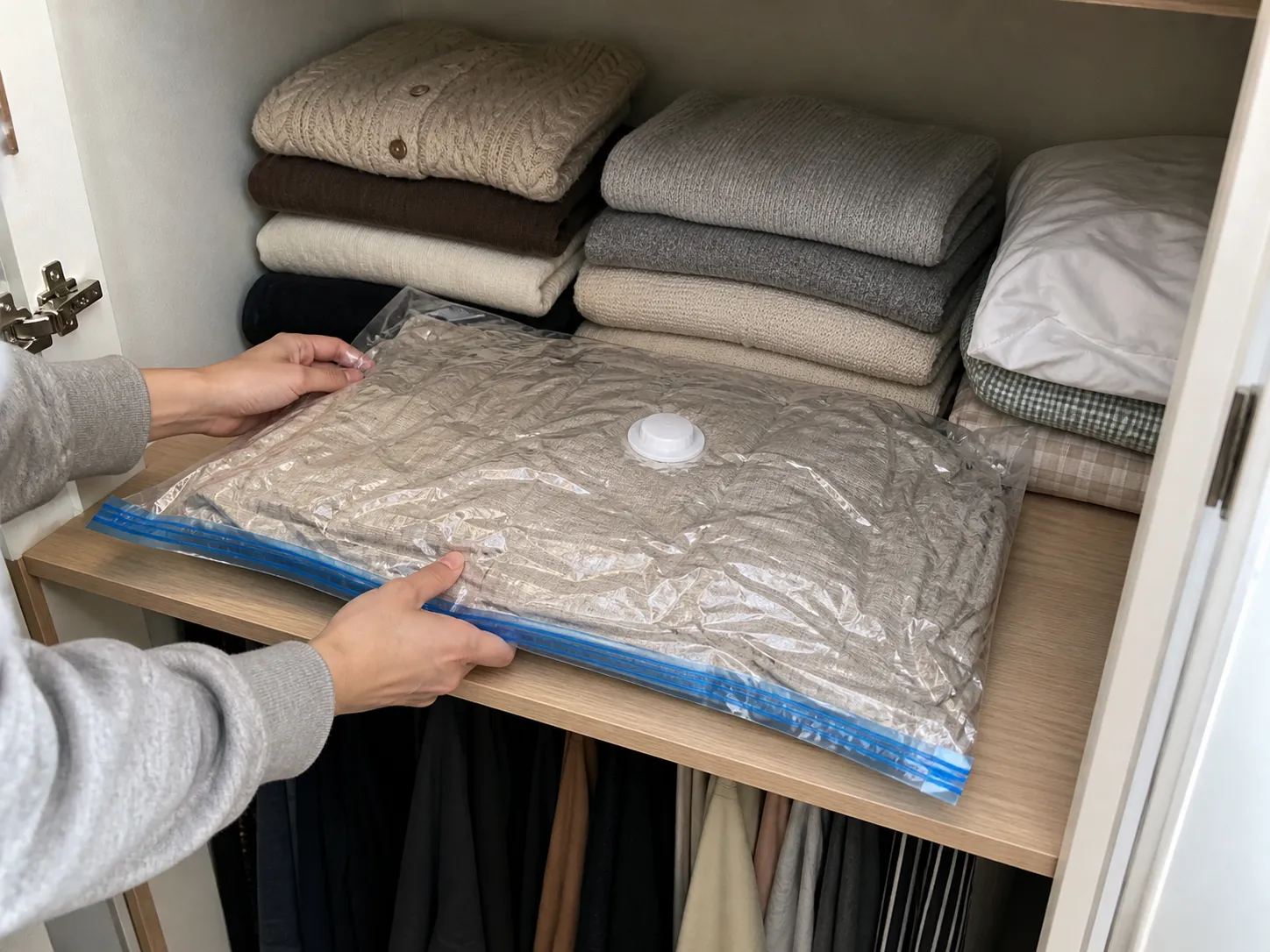 Compressed storage bag on a closet shelf