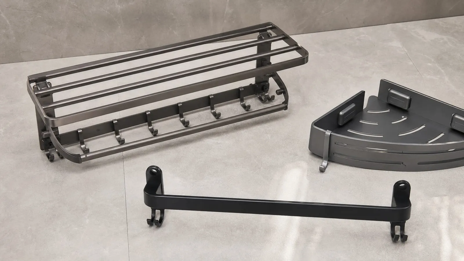 Three bathroom organizer options on tile: a gray towel shelf rack, a black towel bar, and a gray corner shelf