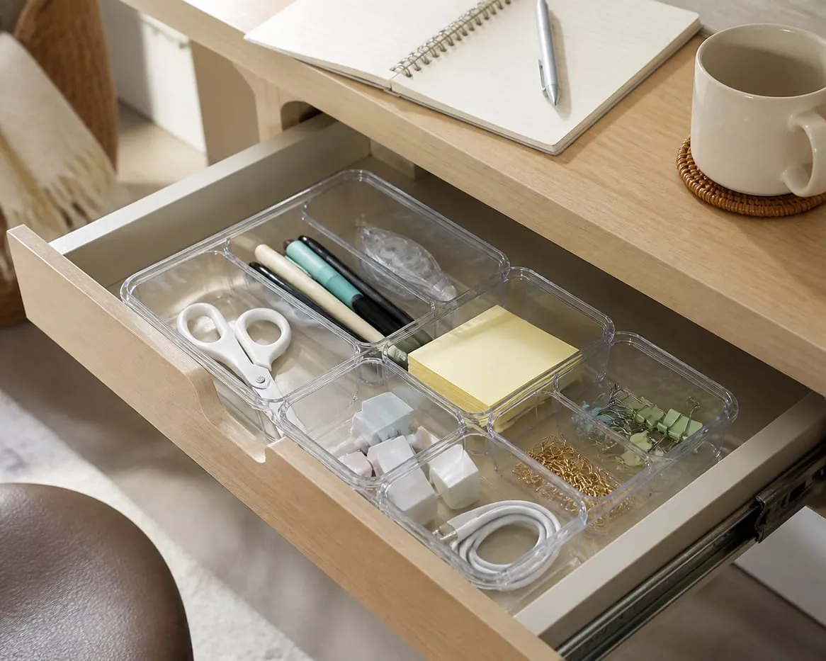 Desk items sorted in a clear organizer