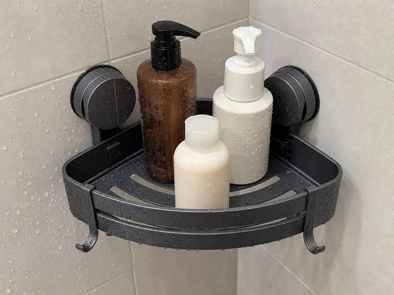 Close-up of the slotted base on a suction-cup corner shower caddy