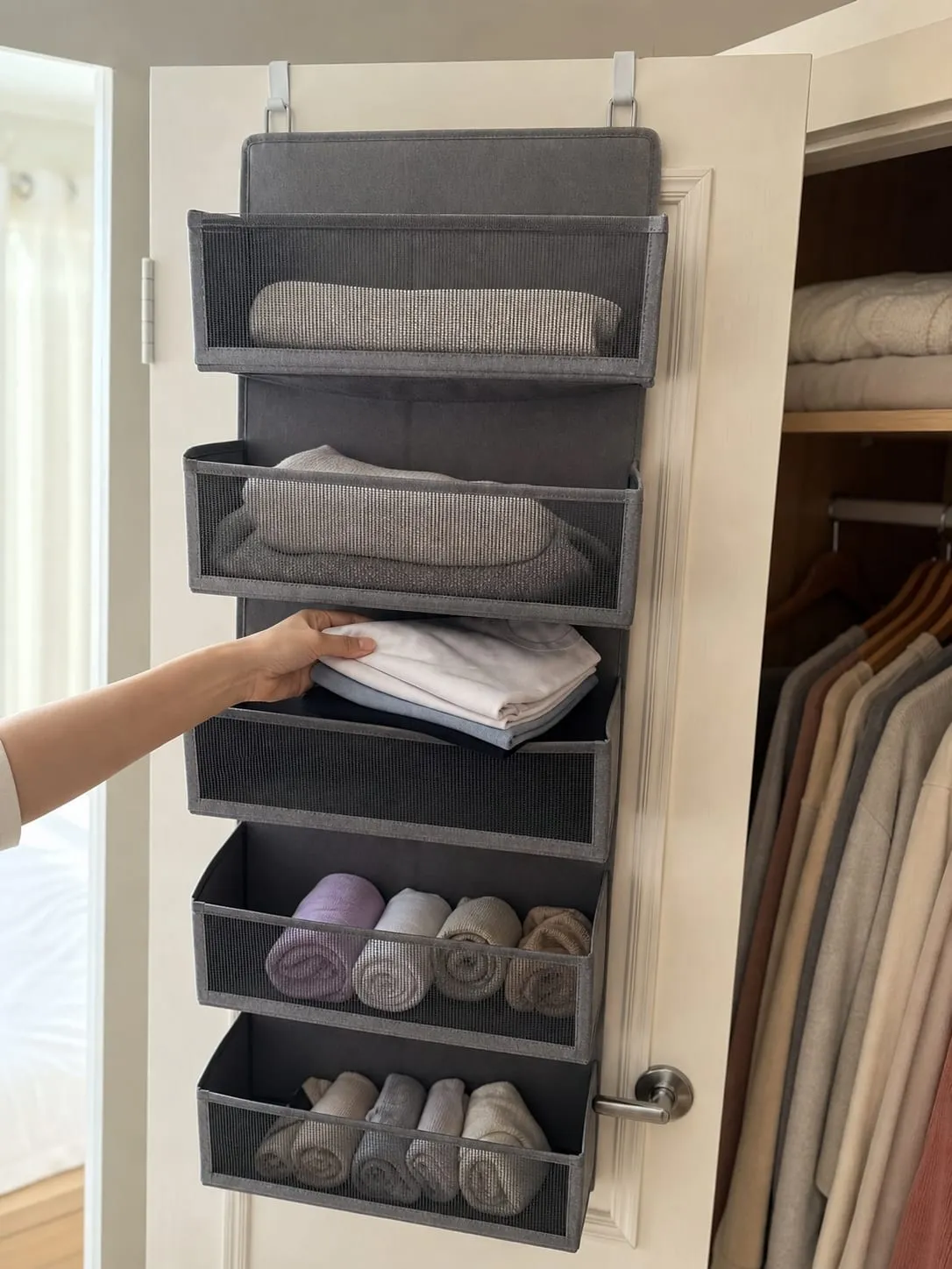 Placing a small folded T-shirt stack into the middle pocket