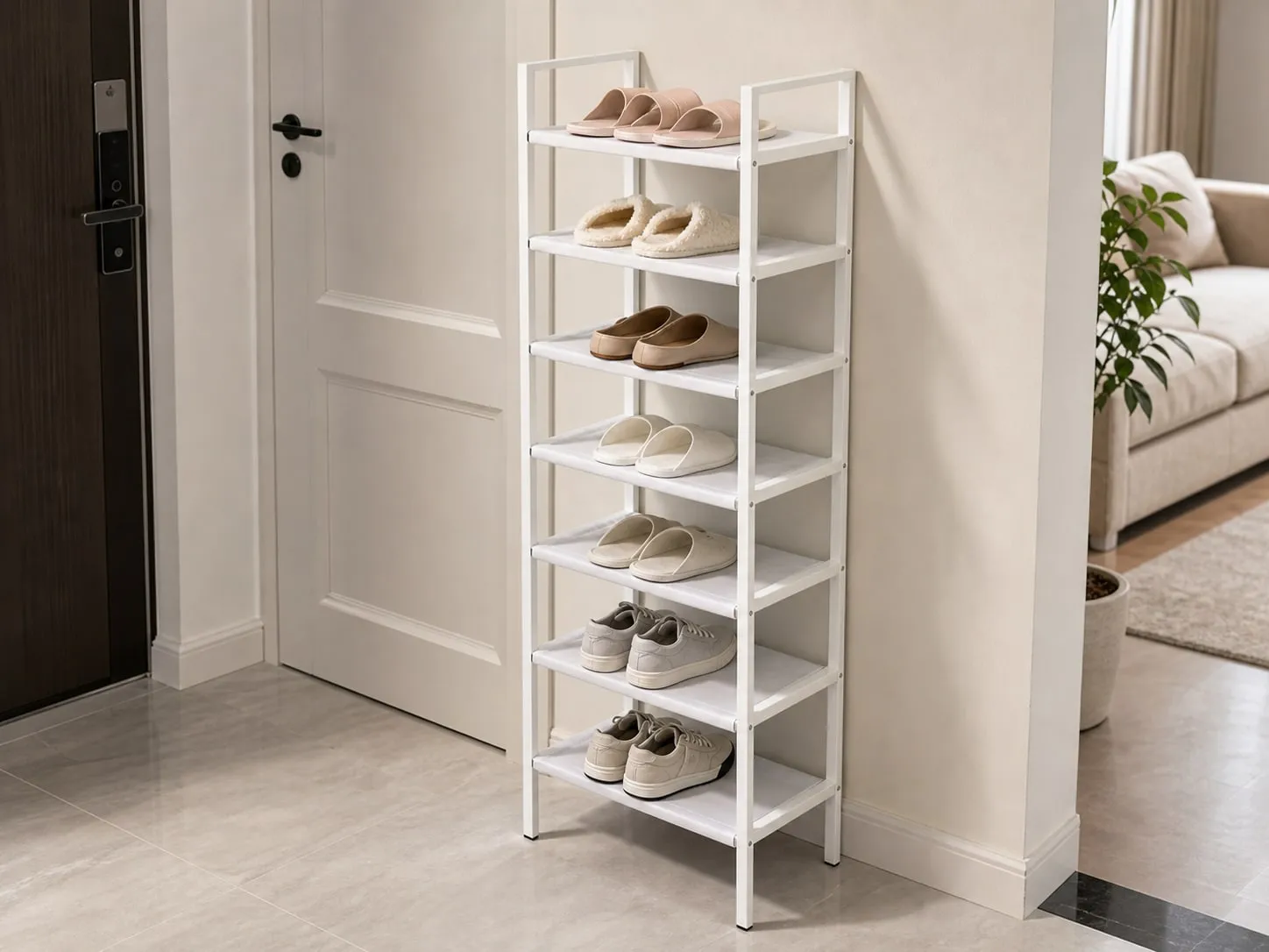 Narrow shoe rack placed against a wall with heavier low sneakers on lower shelves and lighter shoes above