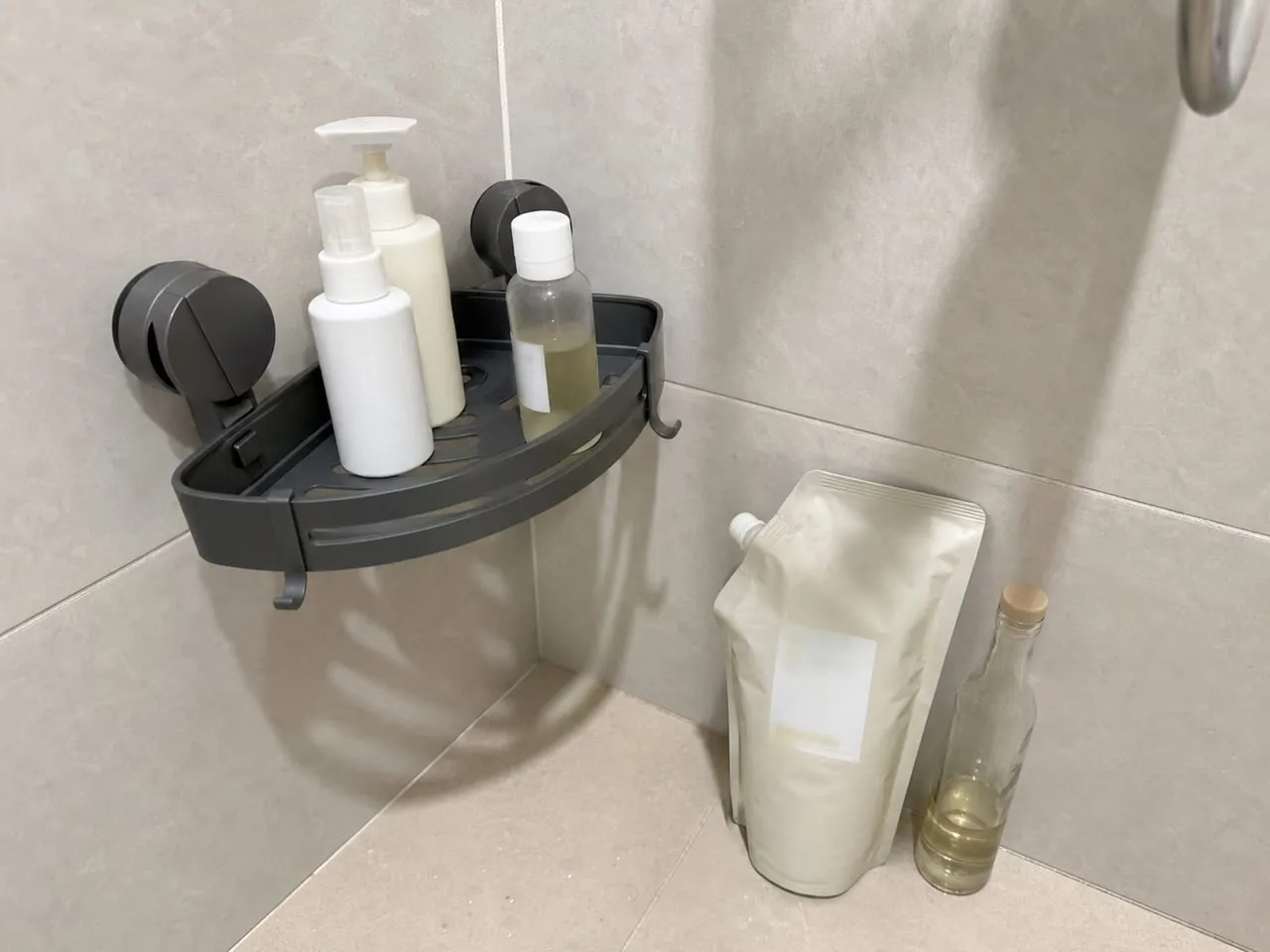 Normal bottles on the caddy while heavier refill containers stay off the rack