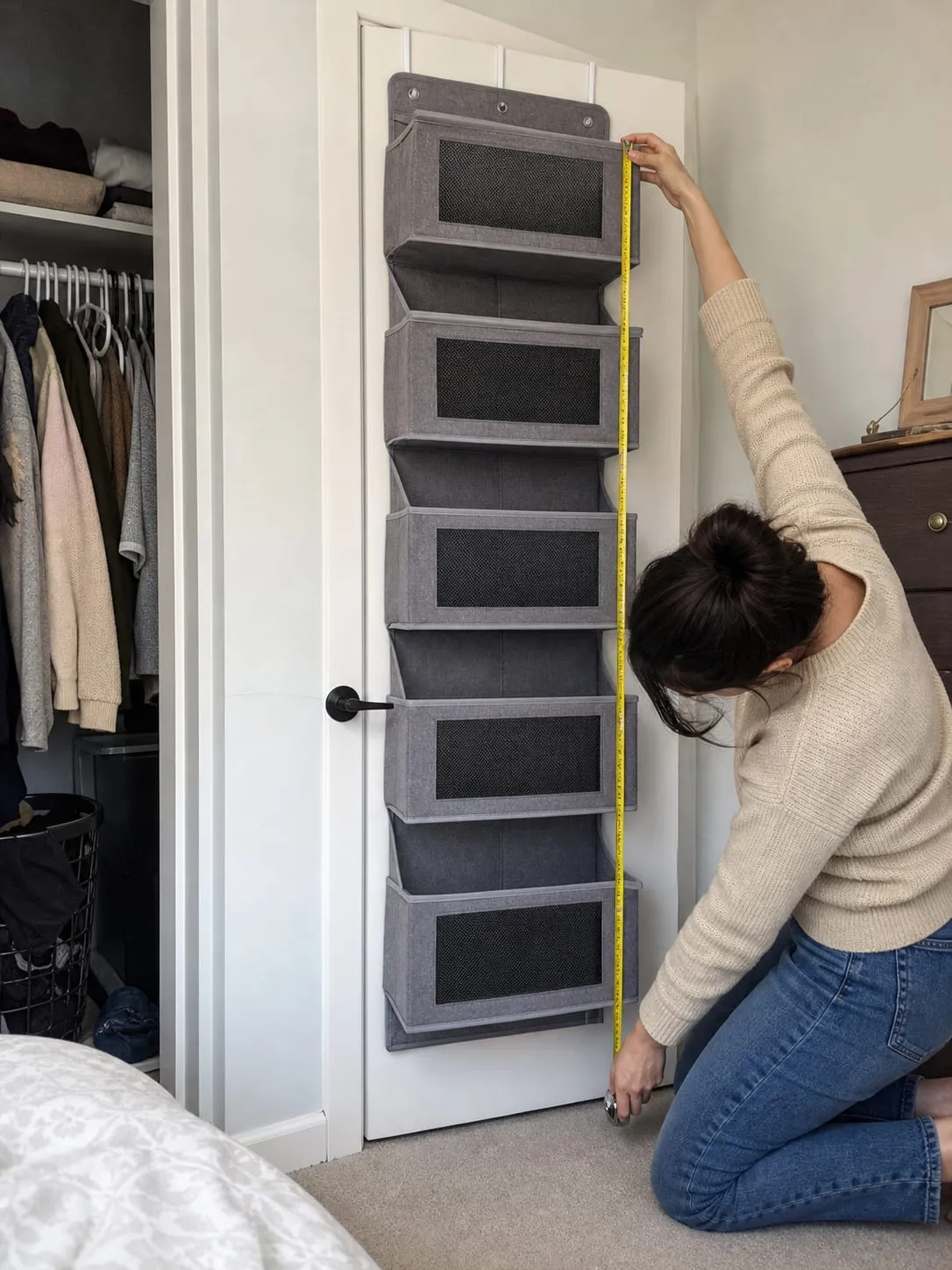 Measuring the handle and floor clearance of an over-door hanging organizer