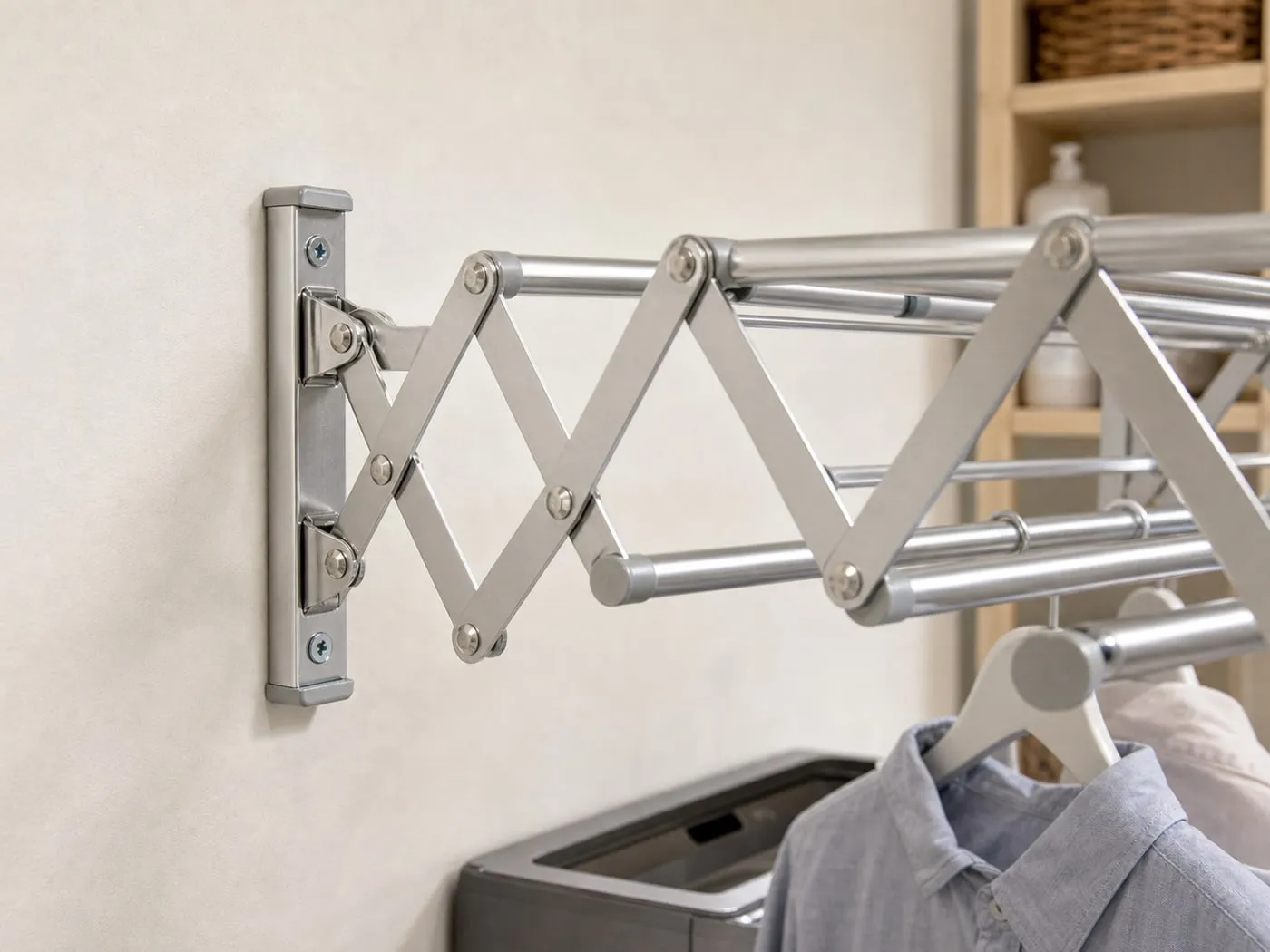 Close-up of the screw-mounted wall bracket of a folding clothes rail