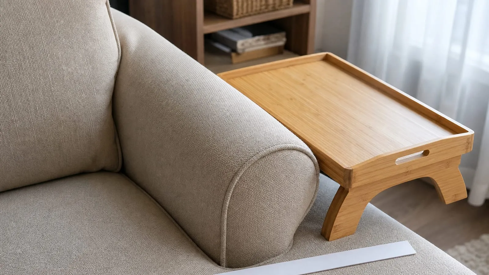 Wood sofa-arm tray placed near a rounded overstuffed armrest to show why the fit may be poor