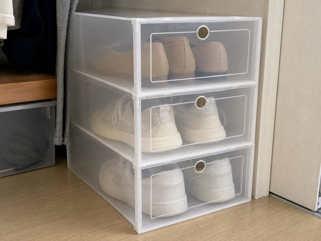 Short stack of translucent shoe boxes with aligned front doors